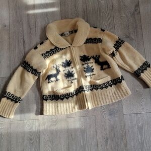 Cozy Cream and Black Sweater with Reindeer Pattern